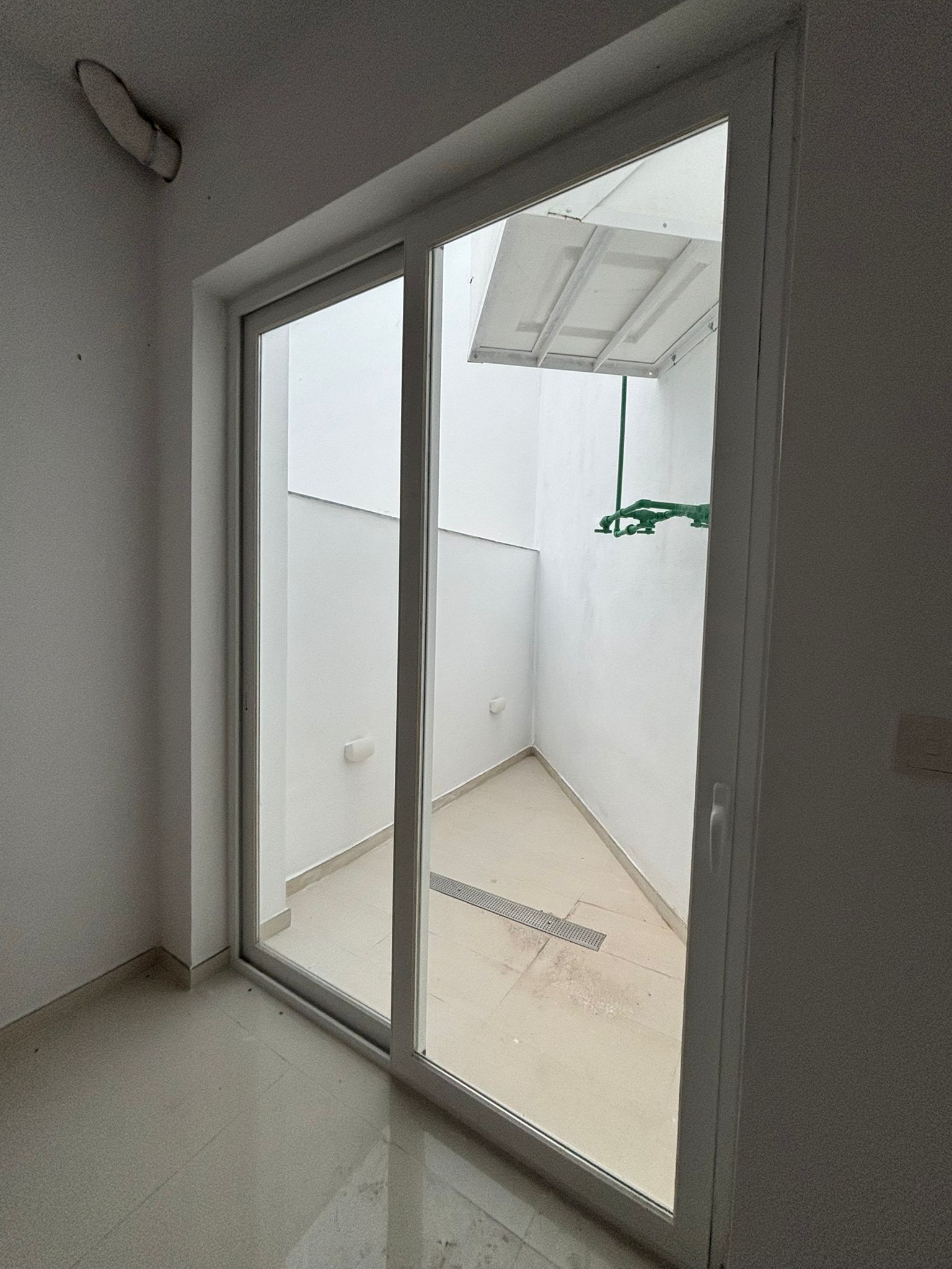 Glass doors to the ground floor office at Green Oasis