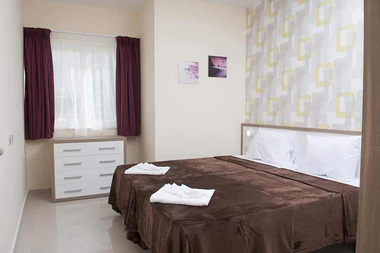 Slaapkamer met tweepersoonsbed in Tigne Residence